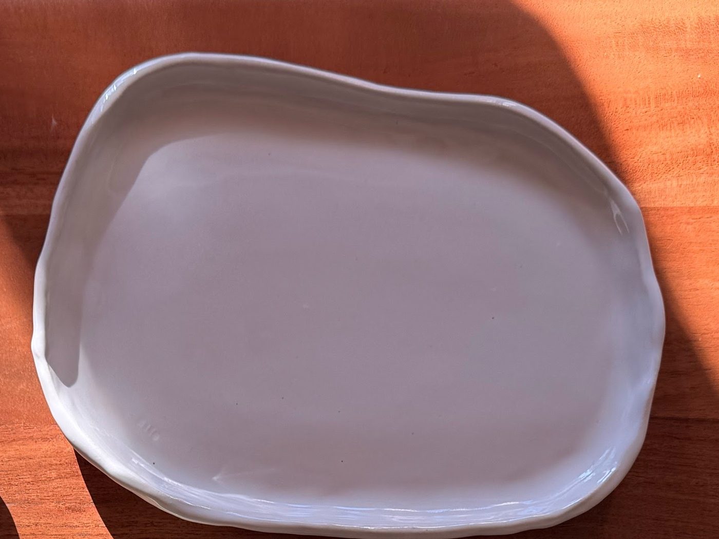 White platter on a wooden table